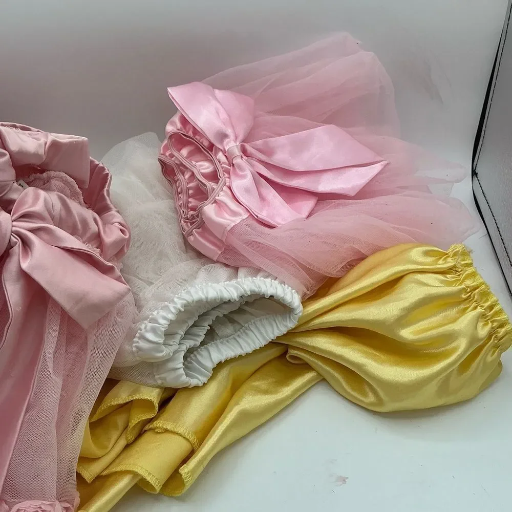 Set of 4 Pink white and Yellow Tutu assorted sizes(2,4,L) but they fit the same